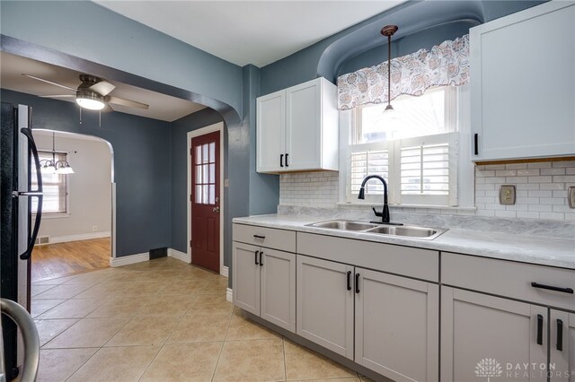 1603 Rosemont Blvd, Dayton, OH 45410 - kitchen with light countertops, light tile patterned floors, and decorative backsplash