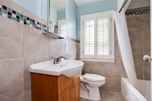 1603 Rosemont Blvd, Dayton, OH 45410 - full bathroom with tile walls, vanity, shower / bathtub combination with curtain, and tile patterned flooring