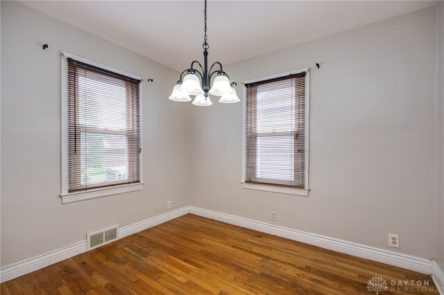 1603 Rosemont Blvd, Dayton, OH 45410 - empty room with a chandelier and hardwood / wood-style floors