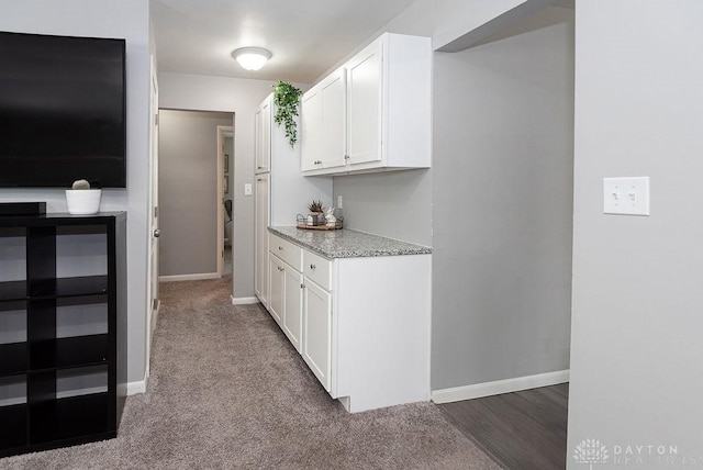 881 Garver Rd, Monroe, OH 45044 - kitchen with white cabinets, light stone countertops, and carpet floors