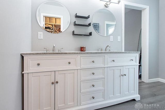 881 Garver Rd, Monroe, OH 45044 - bathroom with double vanity and wood finished floors