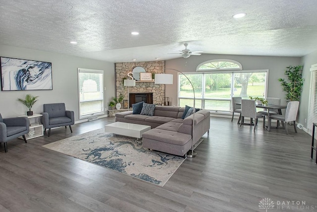 881 Garver Rd, Monroe, OH 45044 - living room with a textured ceiling, a ceiling fan, wood finished floors, a fireplace, and lofted ceiling