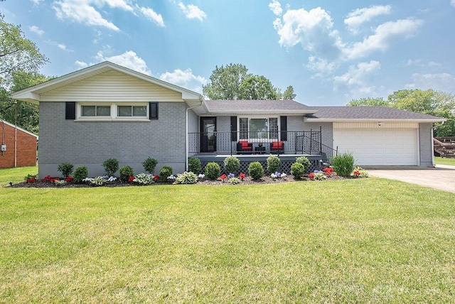 881 Garver Rd, Monroe, OH 45044 - ranch-style house with brick siding, concrete driveway, an attached garage, and a front yard