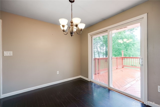 3201 Sears Rd, Spring Valley Twp, OH 45370 - empty room featuring dark wood-style flooring and a chandelier