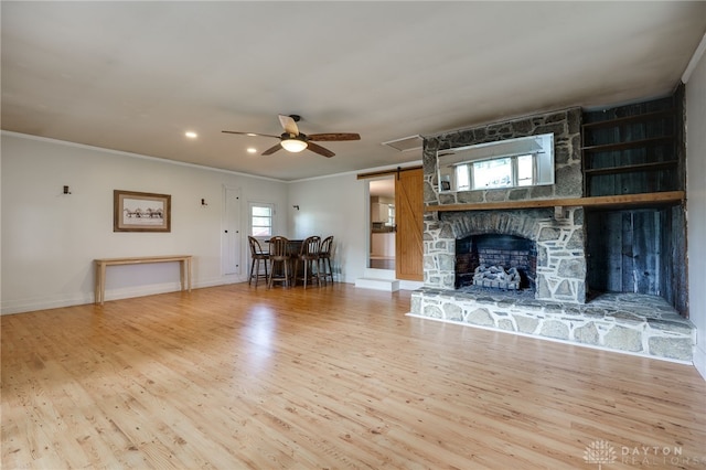 3201 Sears Rd, Spring Valley Twp, OH 45370 - living area with ceiling fan, wood finished floors, crown molding, recessed lighting, and a barn door