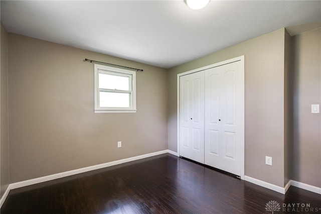 3201 Sears Rd, Spring Valley Twp, OH 45370 - unfurnished bedroom featuring dark wood finished floors and a closet