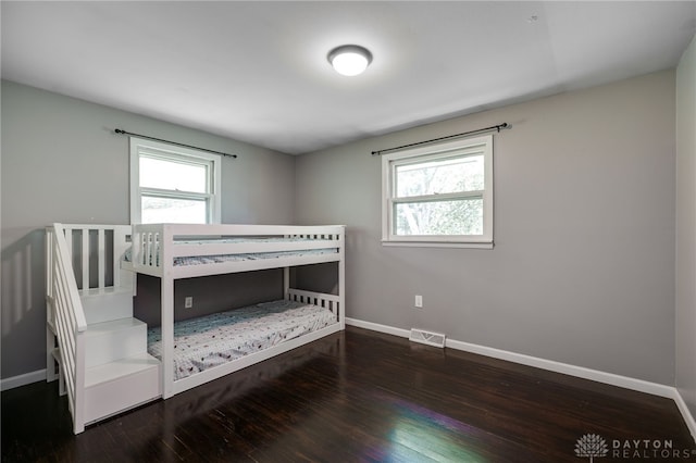 3201 Sears Rd, Spring Valley Twp, OH 45370 - bedroom featuring multiple windows and wood finished floors