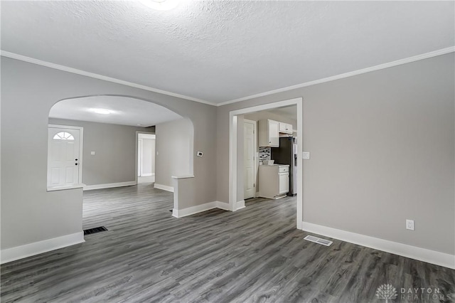 1601 Rausch Ave, Dayton, OH 45432 - empty room with arched walkways, crown molding, dark wood-type flooring, and a textured ceiling