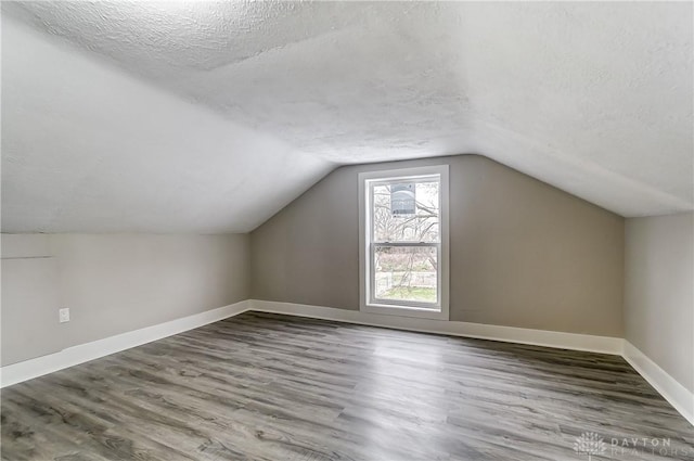 1601 Rausch Ave, Dayton, OH 45432 - bonus room with a textured ceiling, wood finished floors, and vaulted ceiling