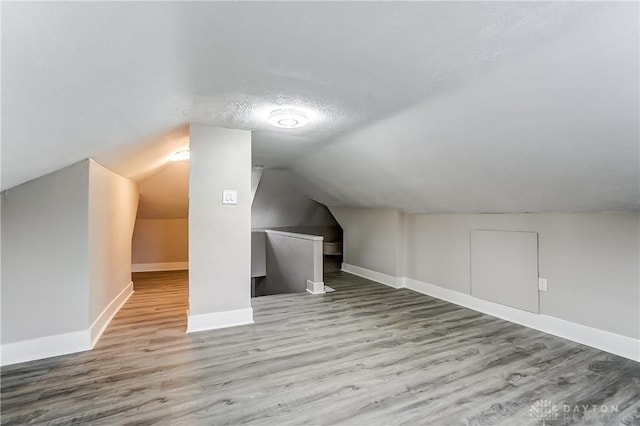 1601 Rausch Ave, Dayton, OH 45432 - bonus room with wood finished floors, lofted ceiling, and a textured ceiling