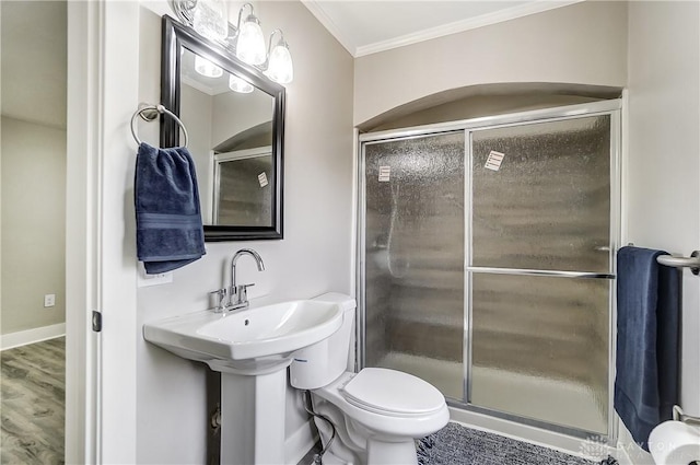 1601 Rausch Ave, Dayton, OH 45432 - bathroom featuring ornamental molding, a shower stall, and wood finished floors