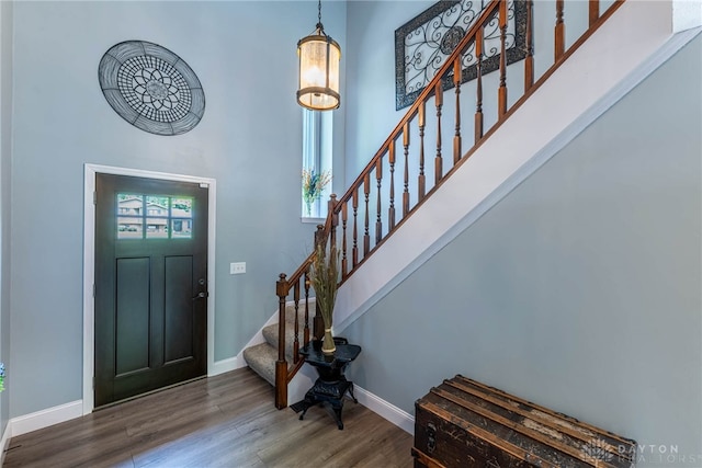 195 Sycamore Creek Dr, Springboro, OH 45066 - entryway featuring a towering ceiling, stairway, and wood finished floors