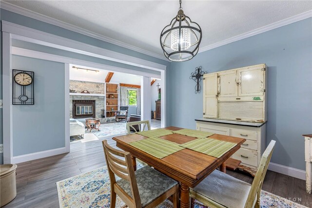195 Sycamore Creek Dr, Springboro, OH 45066 - dining area with a chandelier, wood finished floors, and crown molding