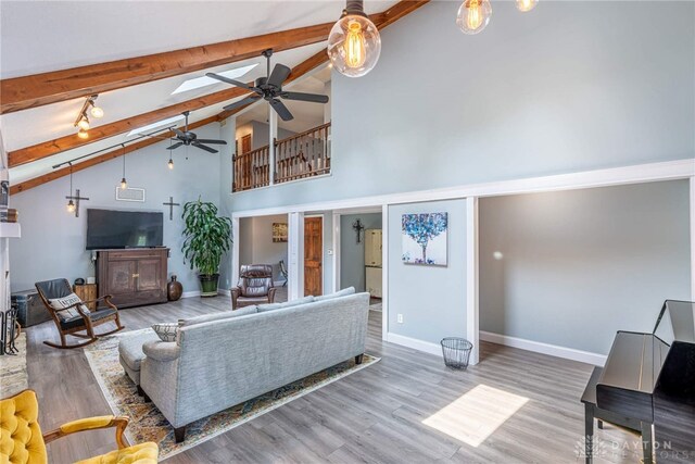 195 Sycamore Creek Dr, Springboro, OH 45066 - living area with a ceiling fan, beamed ceiling, high vaulted ceiling, and wood finished floors