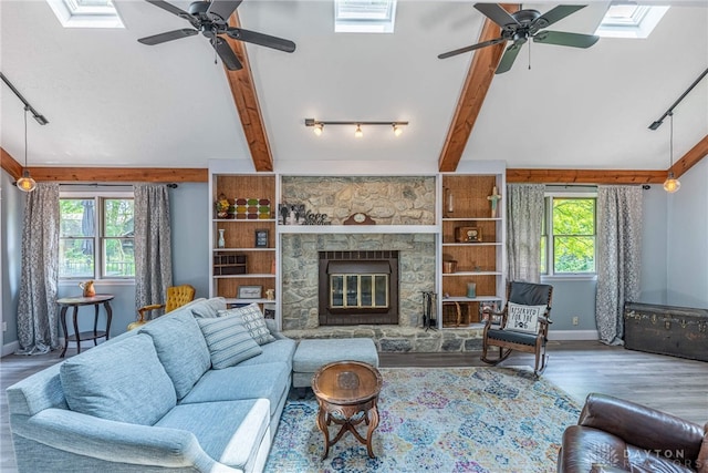 195 Sycamore Creek Dr, Springboro, OH 45066 - living area featuring rail lighting, a ceiling fan, a skylight, and wood finished floors
