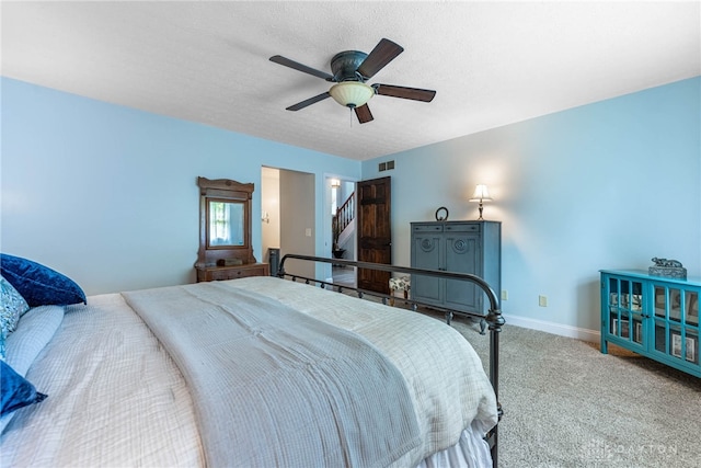 195 Sycamore Creek Dr, Springboro, OH 45066 - carpeted bedroom with a ceiling fan and a textured ceiling