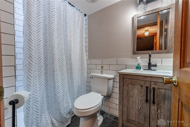 195 Sycamore Creek Dr, Springboro, OH 45066 - full bath with tile walls, vanity, tile patterned flooring, a shower with shower curtain, and wainscoting