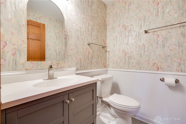 4911 Arabian Dr, Fairborn, OH 45324 - half bath with wallpapered walls, wainscoting, and vanity
