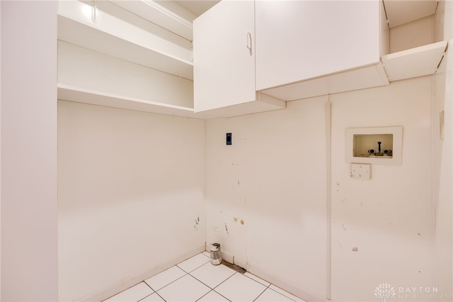 4911 Arabian Dr, Fairborn, OH 45324 - washroom featuring hookup for a washing machine, cabinet space, and light tile patterned floors