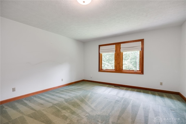 4911 Arabian Dr, Fairborn, OH 45324 - unfurnished room with carpet floors and a textured ceiling