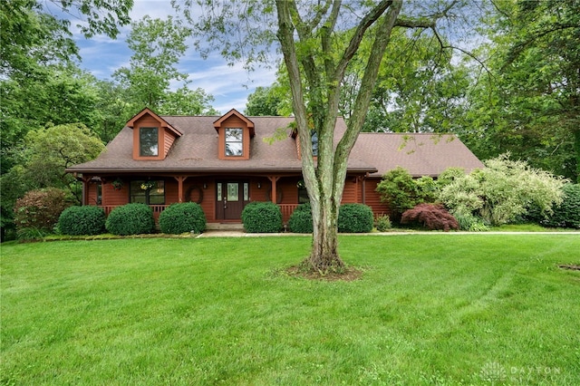4911 Arabian Dr, Fairborn, OH 45324 - view of front facade with a porch, a front yard, and a shingled roof
