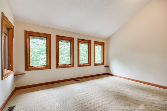 4911 Arabian Dr, Fairborn, OH 45324 - unfurnished room featuring carpet flooring and vaulted ceiling