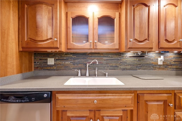 4911 Arabian Dr, Fairborn, OH 45324 - kitchen with dishwasher, glass insert cabinets, decorative backsplash, brown cabinets, and light countertops