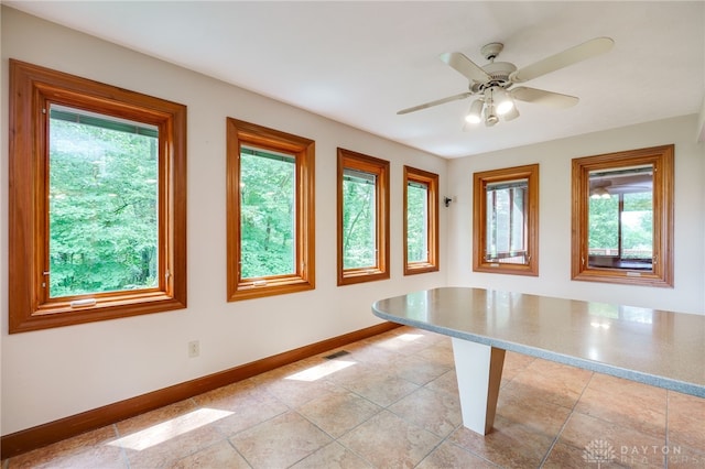 4911 Arabian Dr, Fairborn, OH 45324 - unfurnished dining area with plenty of natural light and a ceiling fan