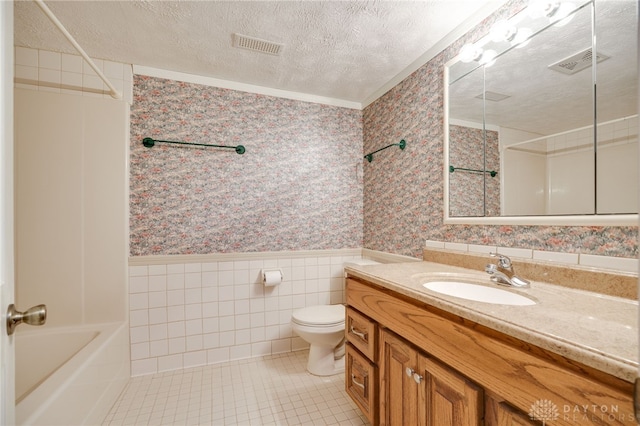 4911 Arabian Dr, Fairborn, OH 45324 - bathroom with wallpapered walls, a textured ceiling, wainscoting, vanity, and tile patterned flooring