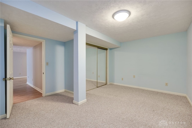 4911 Arabian Dr, Fairborn, OH 45324 - unfurnished bedroom with carpet floors, a textured ceiling, and a closet