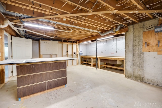 4911 Arabian Dr, Fairborn, OH 45324 - unfinished basement featuring a workshop area