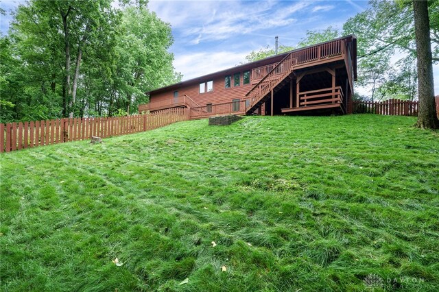 4911 Arabian Dr, Fairborn, OH 45324 - fenced backyard featuring stairs and a deck