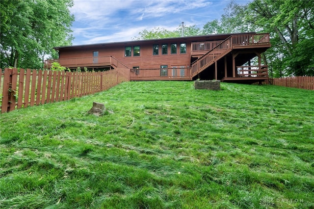 4911 Arabian Dr, Fairborn, OH 45324 - rear view of property with stairway, a fenced backyard, and a deck