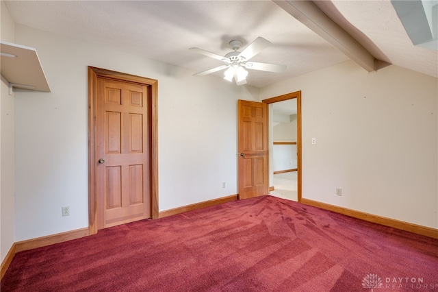 4911 Arabian Dr, Fairborn, OH 45324 - unfurnished bedroom with carpet floors, beam ceiling, and a ceiling fan