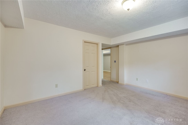 4911 Arabian Dr, Fairborn, OH 45324 - unfurnished room with a textured ceiling and light colored carpet