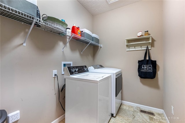 8695 Dijon Ct, Washington Twp, OH 45458 - laundry area with washing machine and dryer and baseboards