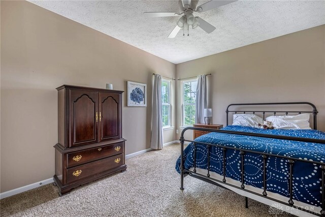 8695 Dijon Ct, Washington Twp, OH 45458 - bedroom with light colored carpet, a textured ceiling, and a ceiling fan
