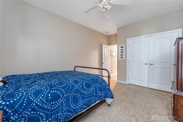 8695 Dijon Ct, Washington Twp, OH 45458 - carpeted bedroom with a closet, ceiling fan, and a textured ceiling