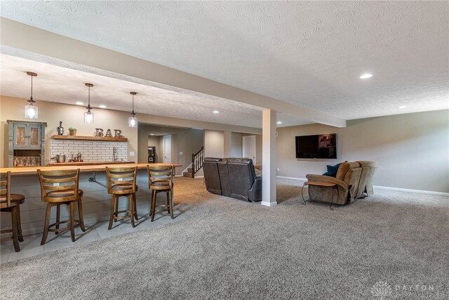 8695 Dijon Ct, Washington Twp, OH 45458 - indoor wet bar with recessed lighting, light colored carpet, a textured ceiling, pendant lighting, and stairway