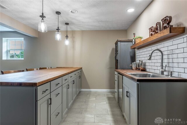 8695 Dijon Ct, Washington Twp, OH 45458 - kitchen with wood counters, open shelves, a peninsula, backsplash, and recessed lighting