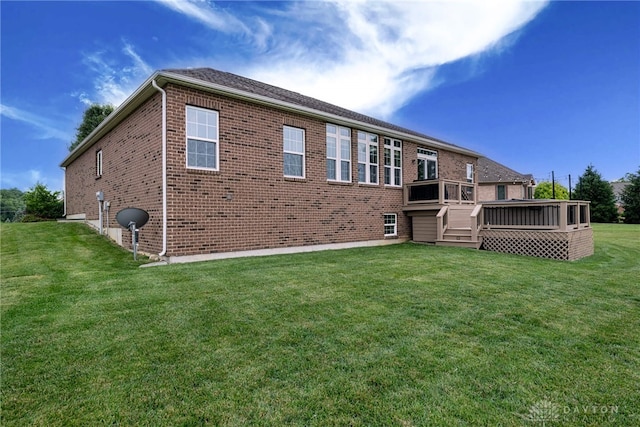 8695 Dijon Ct, Washington Twp, OH 45458 - rear view of property featuring brick siding, a wooden deck, and a yard