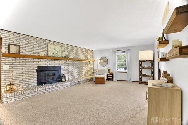 116 Whisman Dr, Middletown, OH 45042 - carpeted living area with brick wall and a fireplace