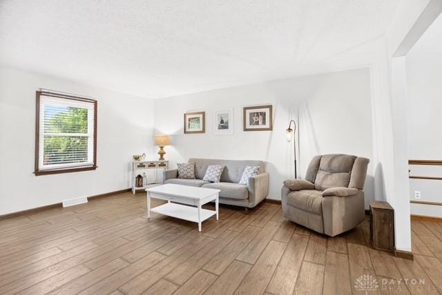 116 Whisman Dr, Middletown, OH 45042 - living area with light wood-style floors and baseboards