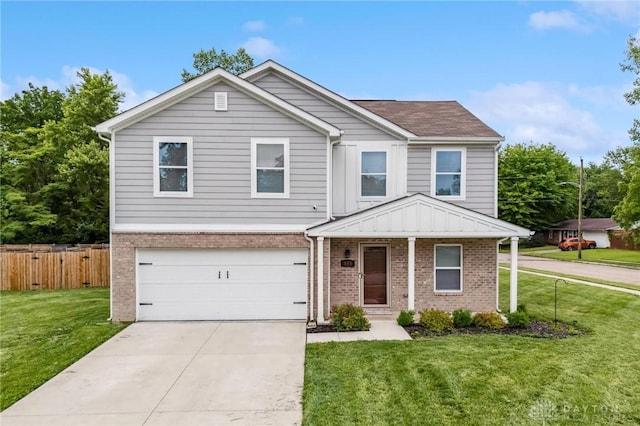 805 Marshall Dr, Xenia, OH 45385 - traditional-style house with brick siding, an attached garage, and driveway