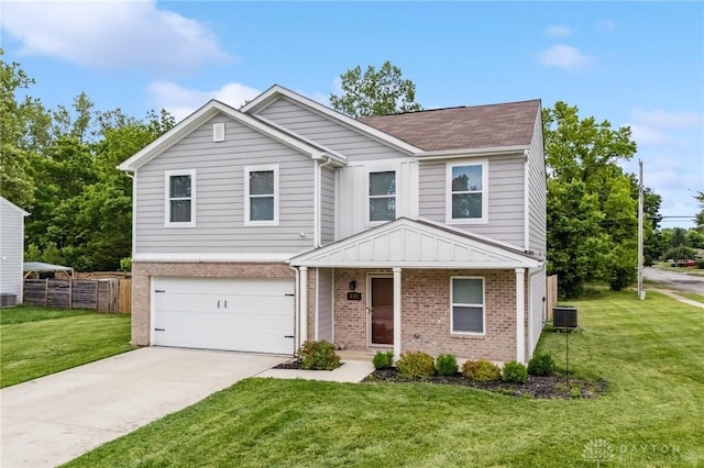 805 Marshall Dr, Xenia, OH 45385 - traditional-style house with brick siding, concrete driveway, a garage, and a shingled roof