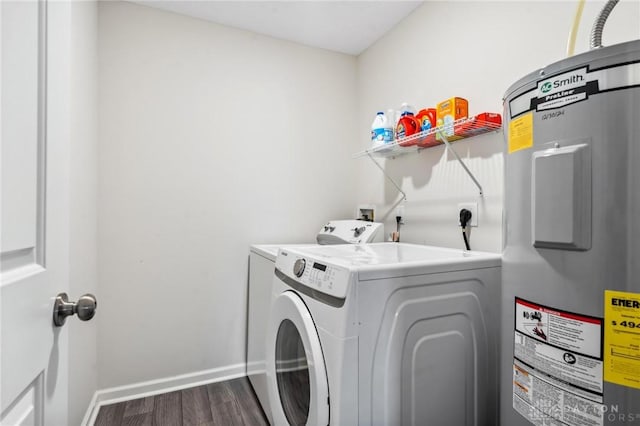805 Marshall Dr, Xenia, OH 45385 - laundry room featuring electric water heater, washing machine and dryer, and dark wood-style flooring