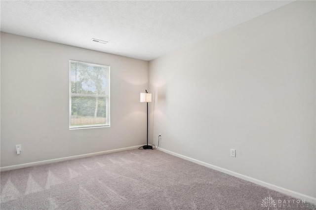 805 Marshall Dr, Xenia, OH 45385 - spare room with carpet and a textured ceiling