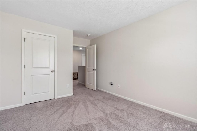 805 Marshall Dr, Xenia, OH 45385 - unfurnished bedroom with carpet flooring and a textured ceiling