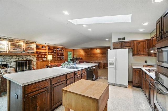 1917 Antrim Ct, Middletown, OH 45042 - kitchen with white refrigerator with ice dispenser, a skylight, oven, a center island, and black dishwasher