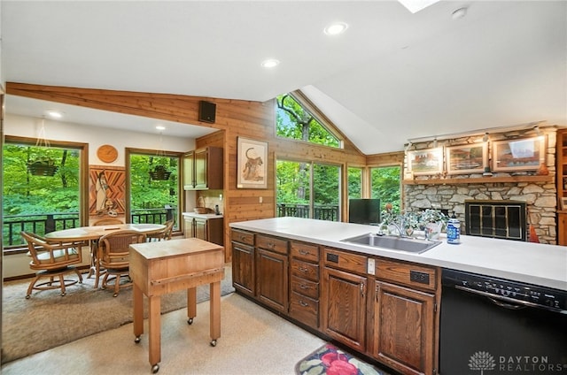 1917 Antrim Ct, Middletown, OH 45042 - kitchen featuring dishwasher, lofted ceiling, light countertops, wood walls, and light colored carpet